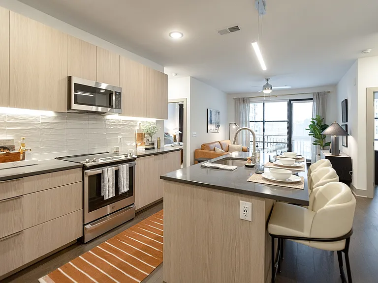 Stylish kitchen with open layout and breakfast bar seating.