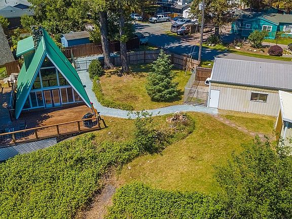 A-FRAME HOME HAS A DETACHED SHOP THAT COULD FIT 3 CARS