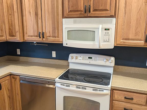 Two year old dishwasher, microwave and electric range