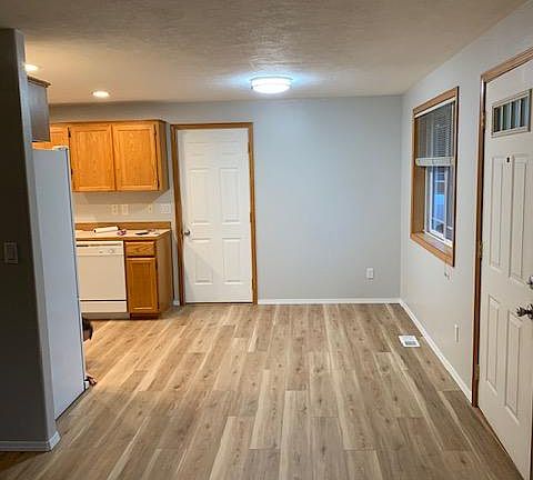 Looking from front of living room towards kitchen