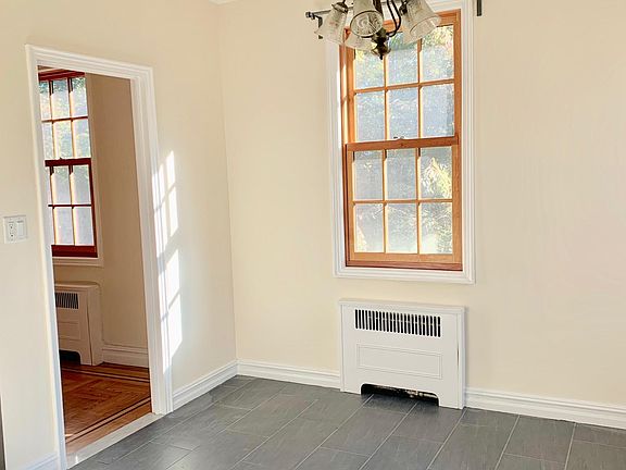 Breakfast nook, large enough for informal dining of 5-6 people, passage to living room, built in bench.