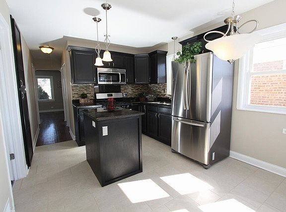 4th image of 11004 S Millard Ave