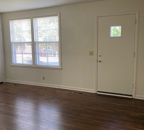 Front door to living room. Has coat closet in this room