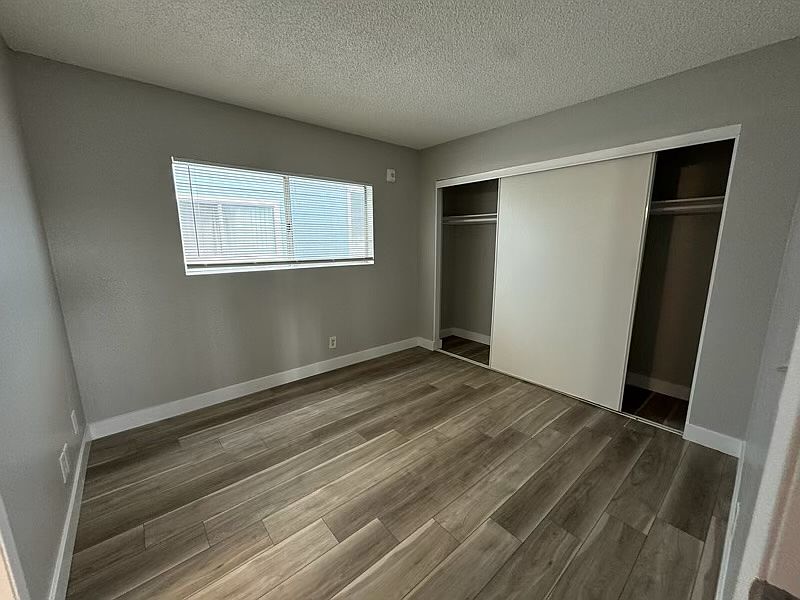 Spacious bedroom #1 with new flooring and new paint.