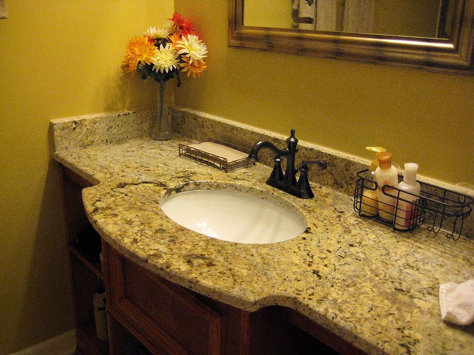 secondary full bathroom with granite countertops