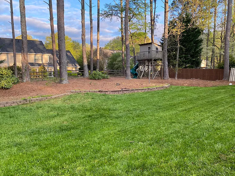 A backyard featuring a playset