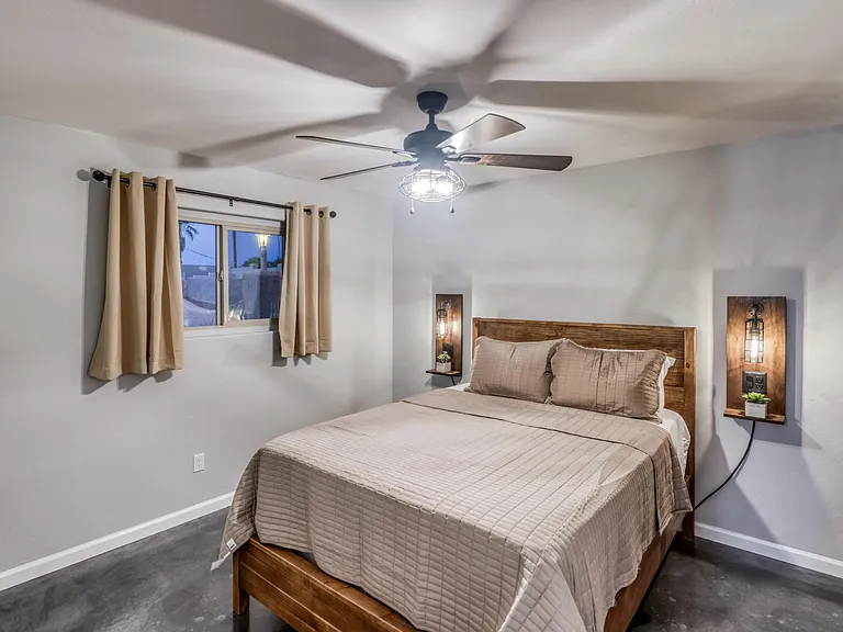 Well-proportioned Guest bedroom with balanced lighting and modern design elements.