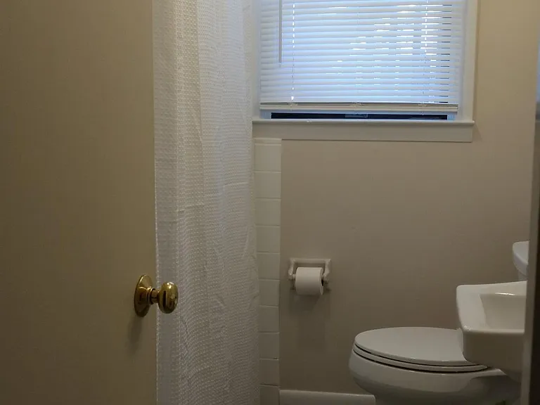 bathroom with tub and large closet