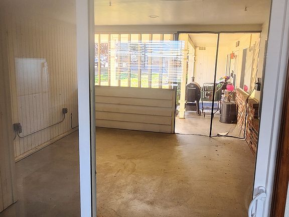 covered and screened in patio with access from kitchen and living room