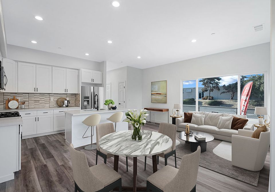Dining + Kitchen + Living room Staged