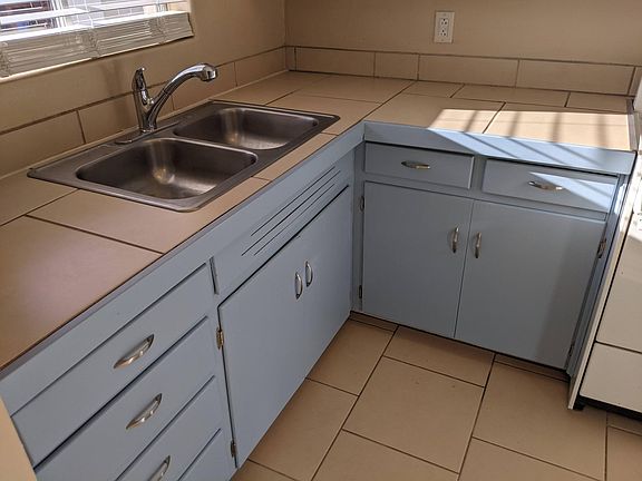 Kitchen sink under window