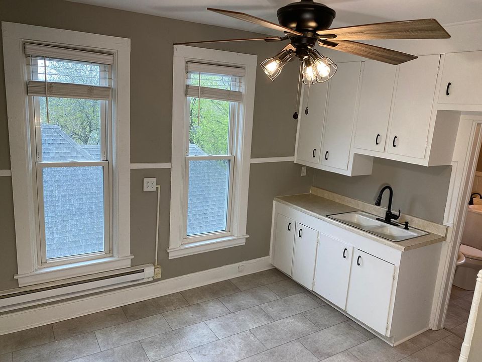 Kitchen with bathroom door on right