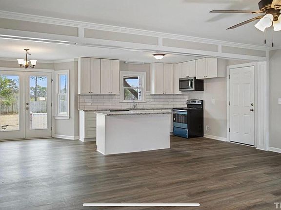 Modern freshly renovated kitchen with brand new cabinets that has soft close drawers and doors.