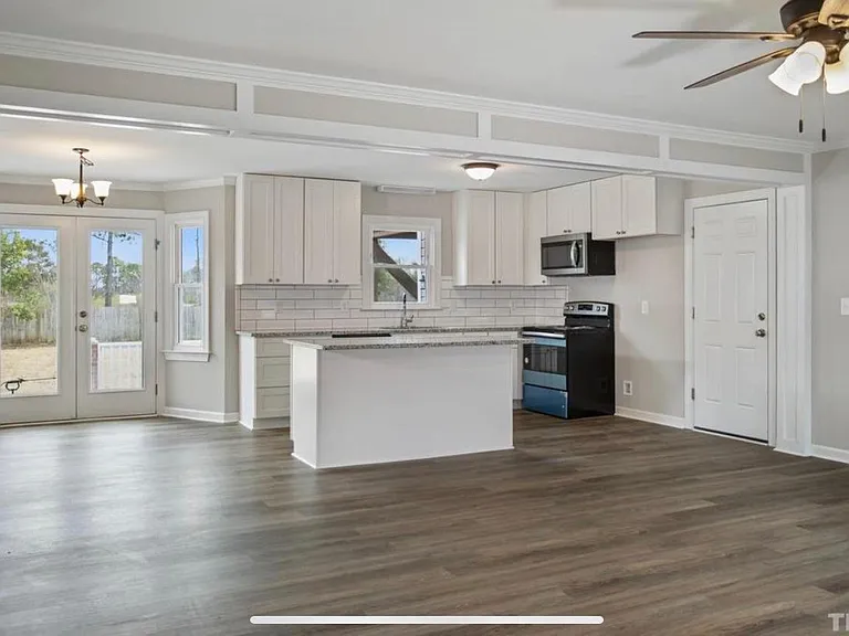 Modern freshly renovated kitchen with brand new cabinets that has soft close drawers and doors.