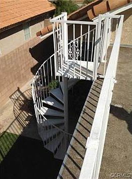 Spiral staircase to backyard from Master