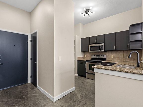 Looking at the door from the inside, kitchen to right.