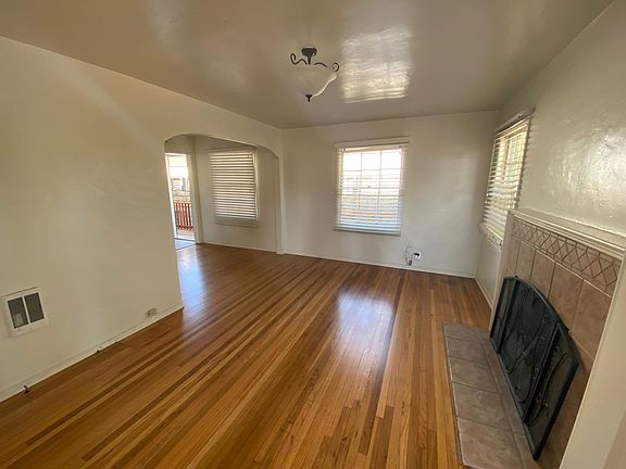 View of living room from the front door. Dining area is on the upper left and around the corner.