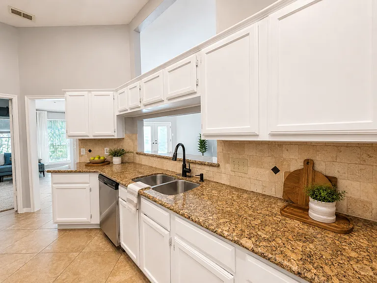kitchen with new cabinet hinges, staged