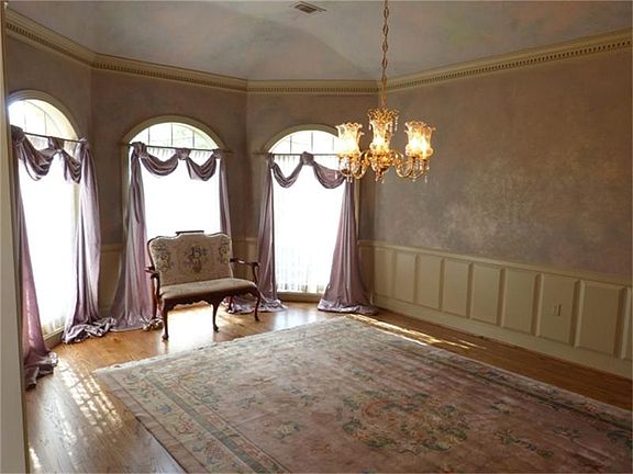 Formal Dining with hardwood floors and amazing woodwork