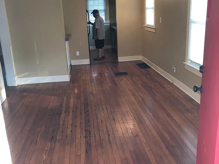 What you see as enter front door: Living room ahead of you, dining nook in corner on right, bedrooms back on left, kitchen right ahead as you walk through.