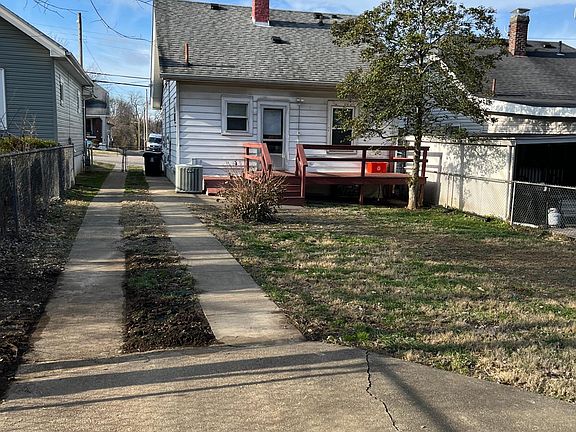 Large, fully fenced back yard with deck and exterior entrance to basement.