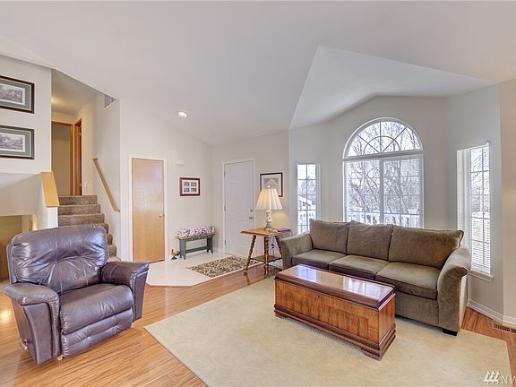 Hardwood floors and a gas fireplace beautifully accent the open design of the main floor.  