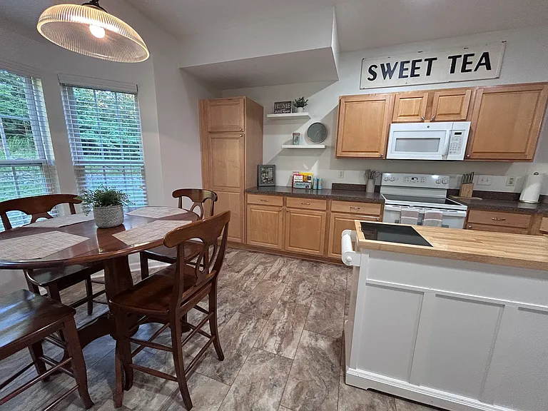 Huge kitchen with breakfast table and movable island.