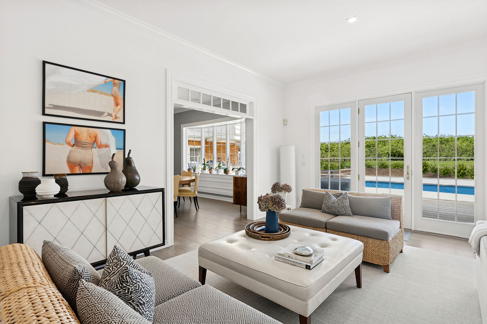 Multiple seating areas, walls of windows and glass doors