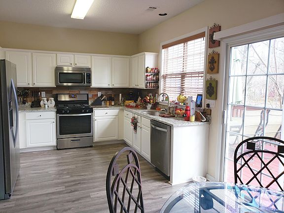 Stainless steel appliances with gas range.