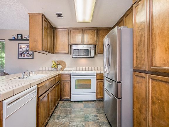 5th image of 6055 E Iowa Ave