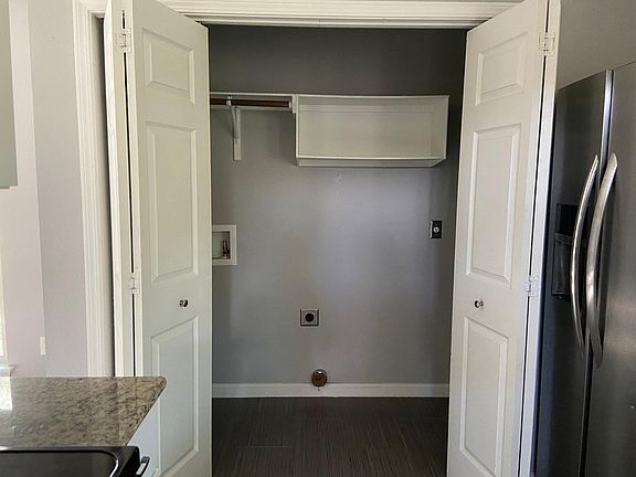 Laundry closet in kitchen.