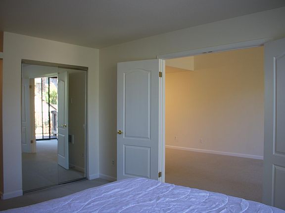 Bedroom with one of the three large closets. Bathroom is to the left.
