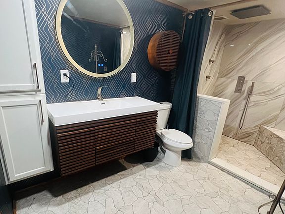 Beautiful marble and stone bathroom with heated floors