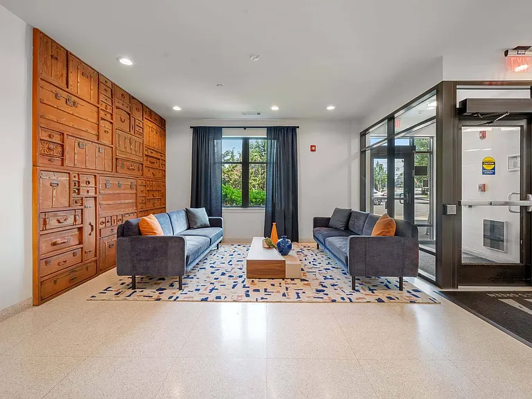 Settle into the lobby seating area, a welcoming space to relax, wait, or catch up with neighbors.