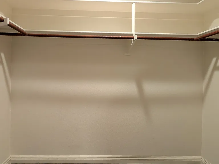 Primary Bedroom walk-in closet