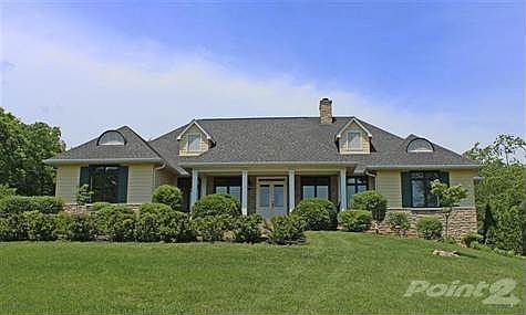 An outstanding ranch with a walk-out basement on 12.2 acres.
