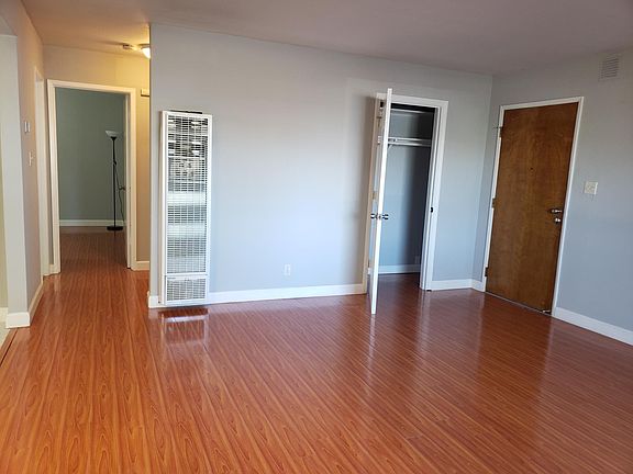 Living room view into the hallway leading to bedrooms 1 and 2.