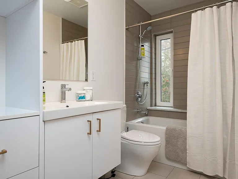 Second full bath across from Bedrooms #2 and #3 with washer and dryer (stacked)