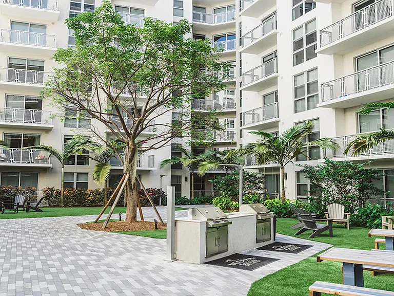 Courtyard with grilling stations and dining areas