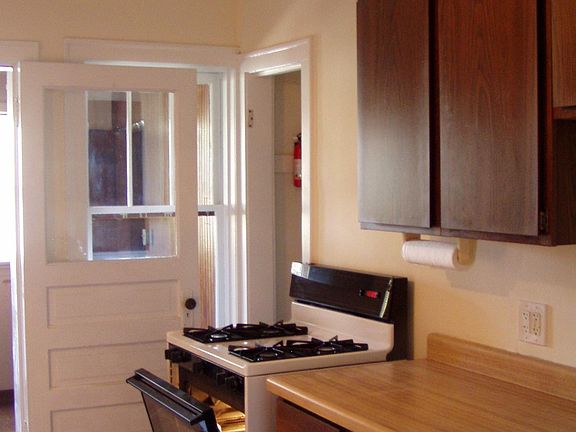 Looking toward gas stove and sun porch.