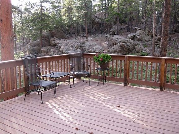 Huge deck w/ view of mountains and rock outcroppings