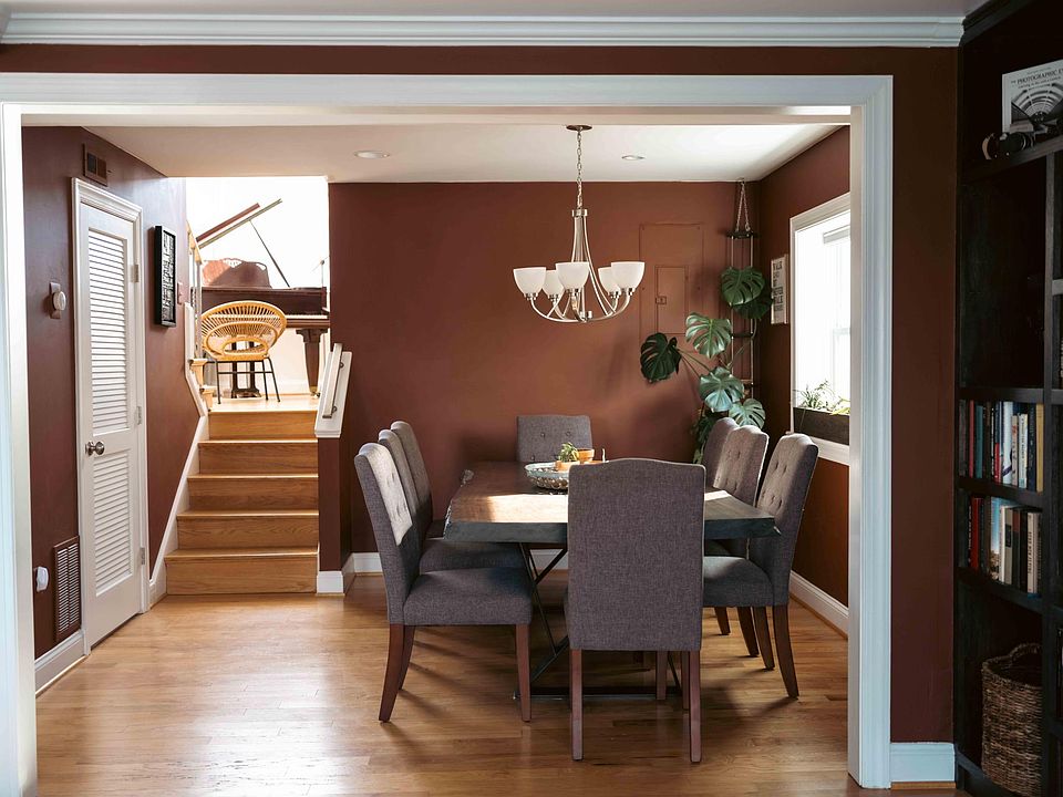 The living room table sits 8 people comfortably. The dining room is located on a split level from the living room upstairs. The second bathroom is located on this floor.