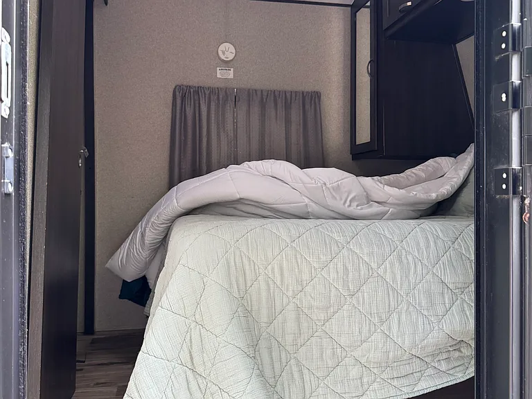 master bedroom with a queen bed.