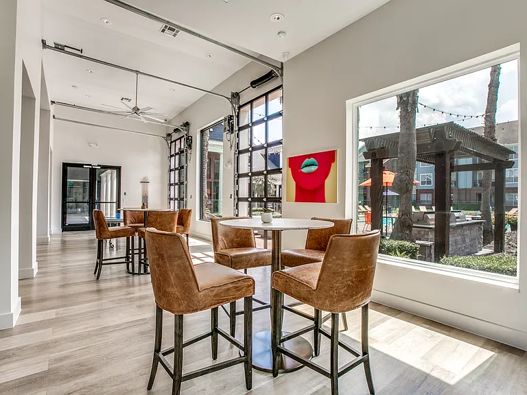 Clubroom with Garage Door Windows Leading to the Pool.