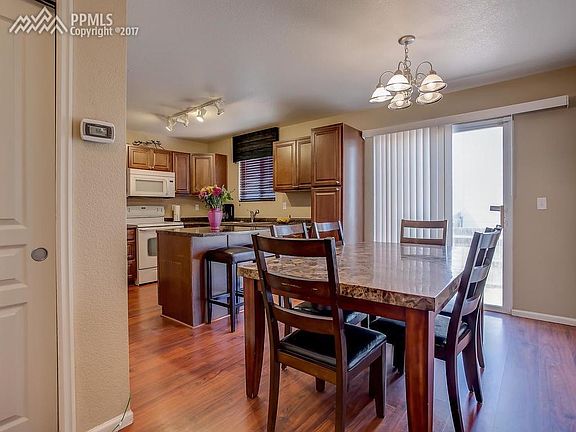 Eat-in Kitchen/Dining area with a walk-out to backyard.