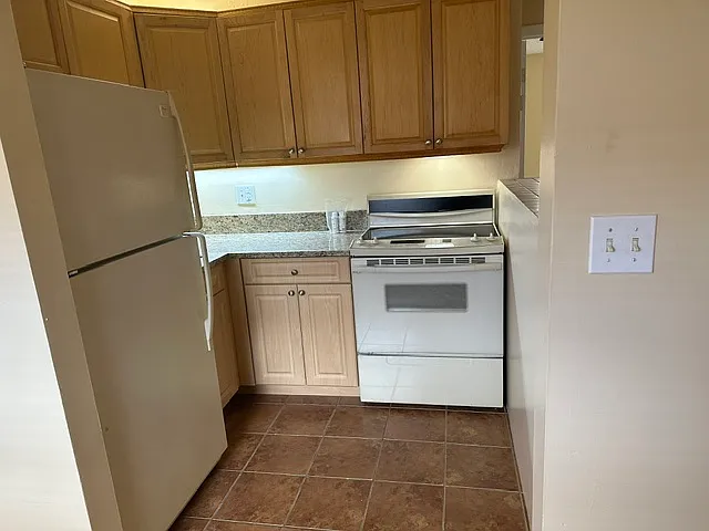 Remodelled Kitchen with wood cabinets.