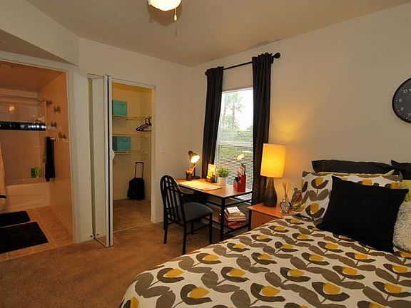 bedroom with on-suite bathroom and huge walk in closet