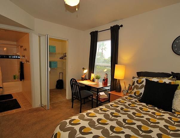 bedroom with on-suite bathroom and huge walk in closet