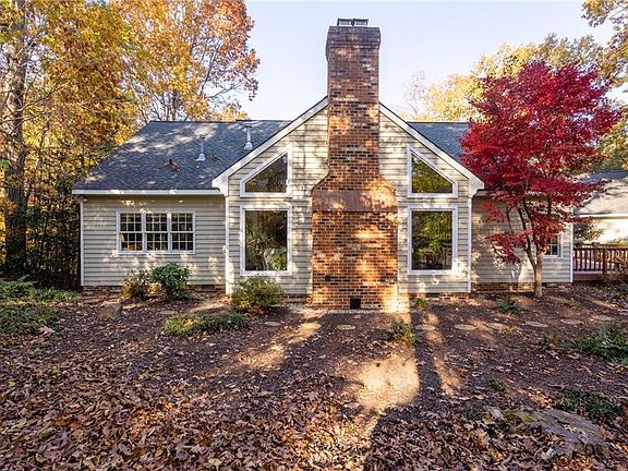Rear elevation with large deck on right, perfect for entertaining.
