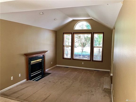 Formal Living room off the main entrance with raised ceiling.